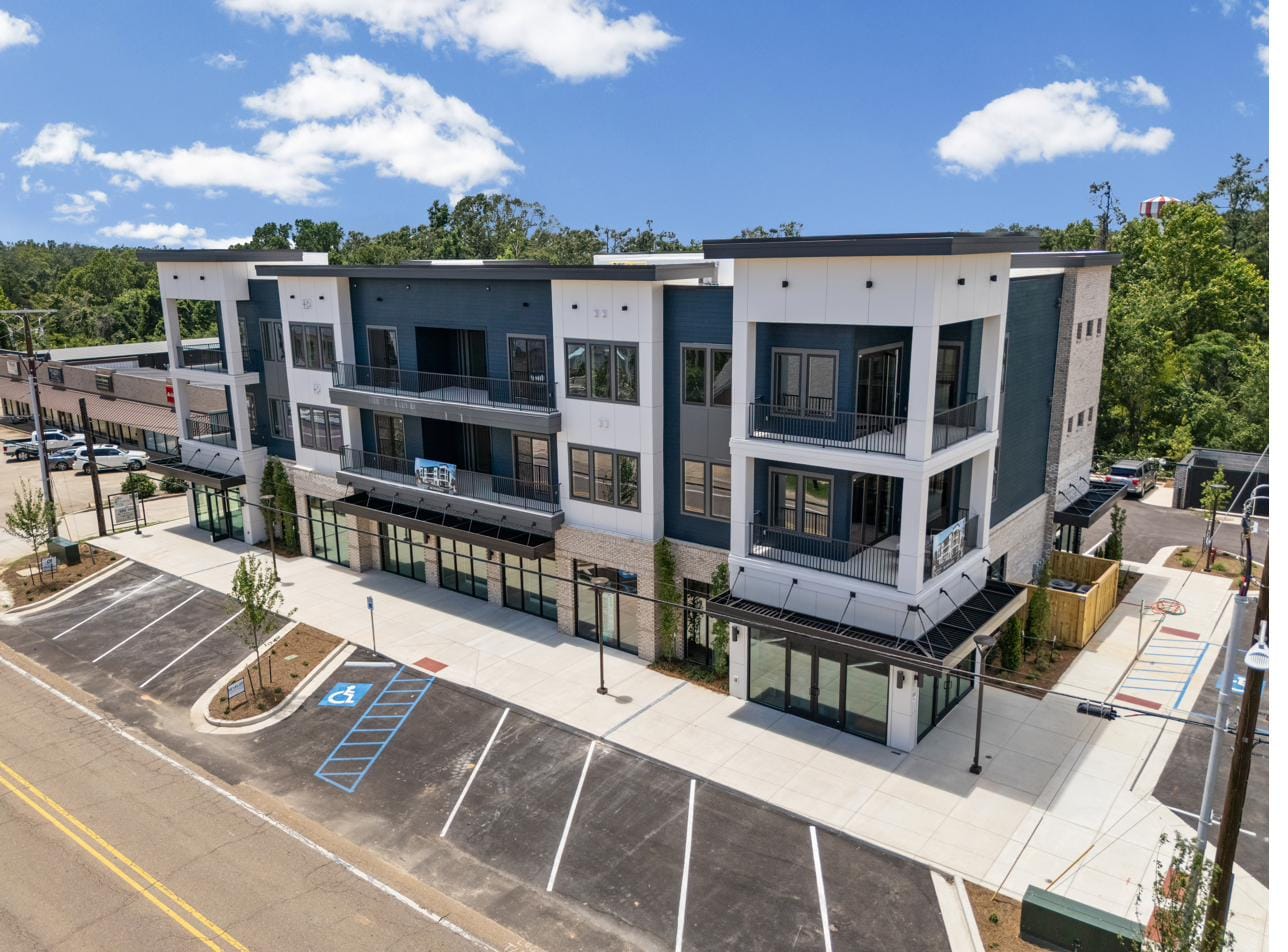 The Breakaway Oxford seen from above at the street corner — a three-story mixed-use building at 1009 North Lamar Boulevard