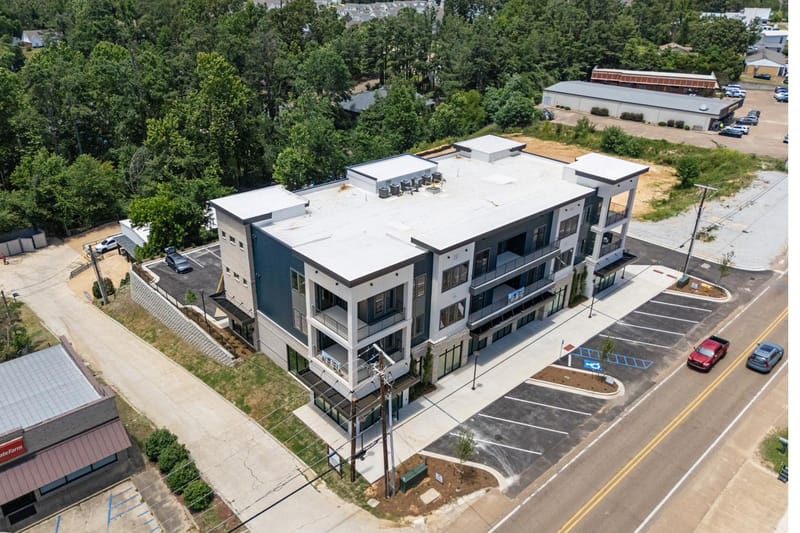 Aerial view of The Breakaway from the rear, with tree cover beyond