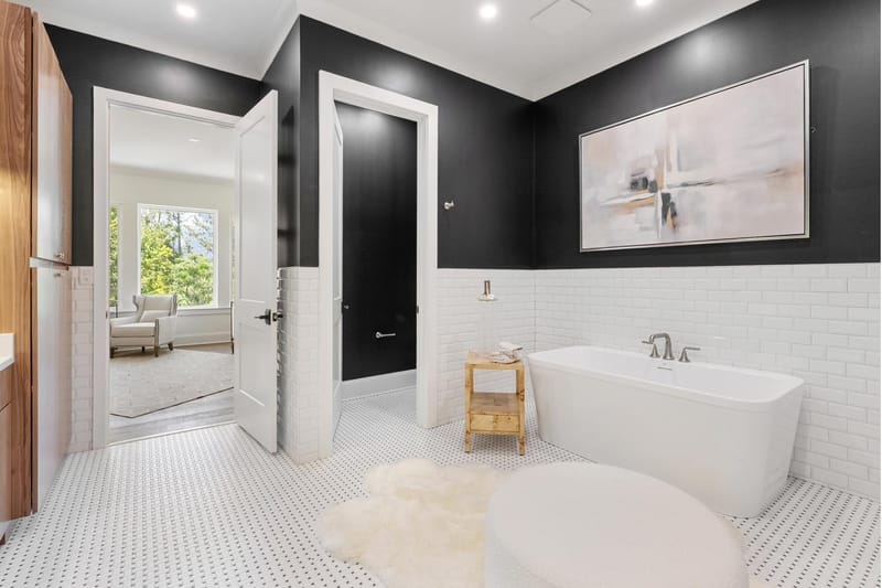 Primary bath with a freestanding tub, looking through to the bedroom