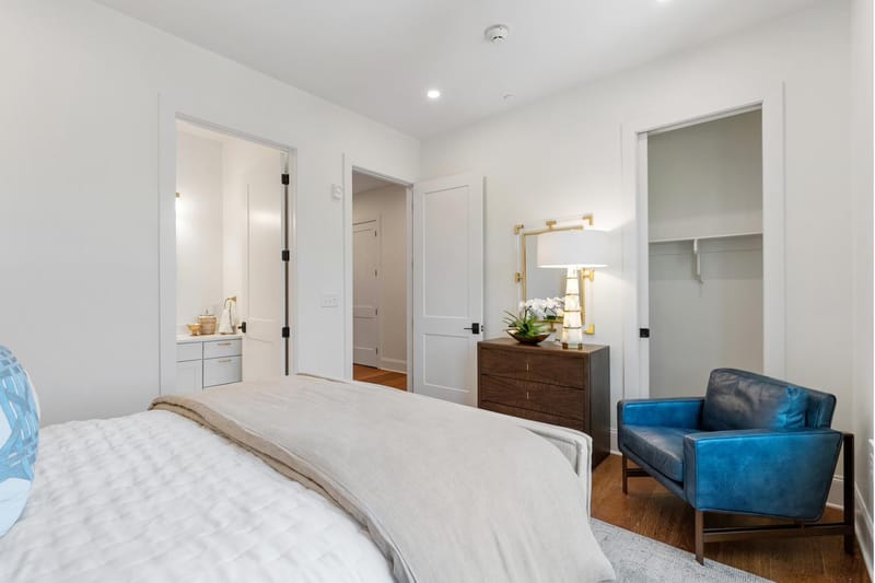 Bedroom with an en-suite bath and a walk-in closet
