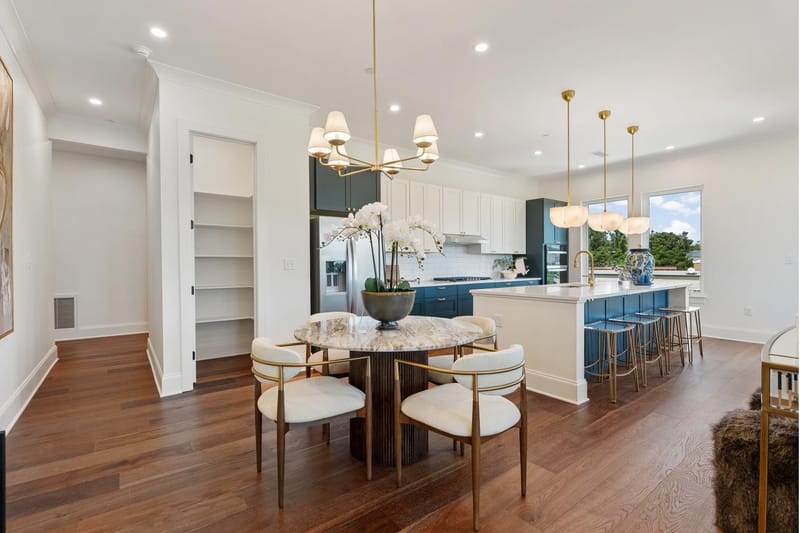 Dining table beside the walk-in pantry, open to the kitchen