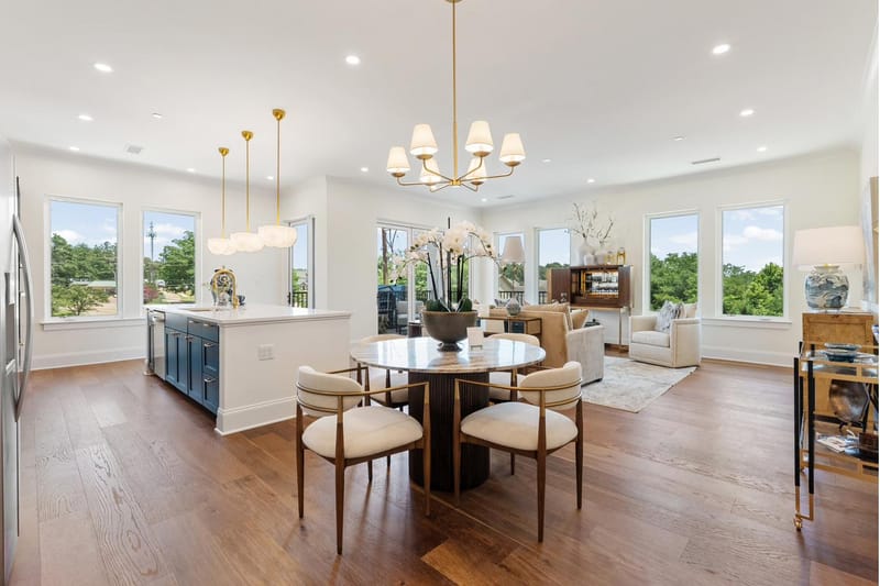 Dining area open to the living room, with windows on two walls