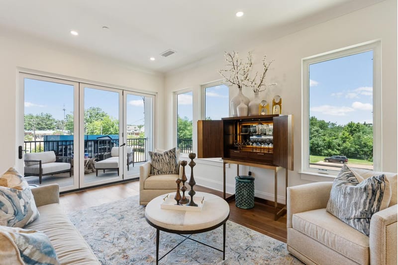 Living room with folding glass doors open to the covered porch